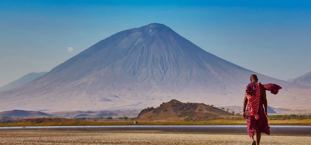 Maasai guide overlooking Ol Doinyo Lengai near Lake Natron